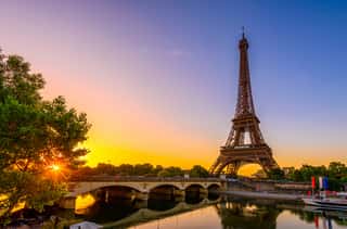 View Of Eiffel Tower And River Seine At Sunrise In Paris, France  Eiffel Tower Is One Of The Most Iconic Landmarks Of Paris Wall Mural
