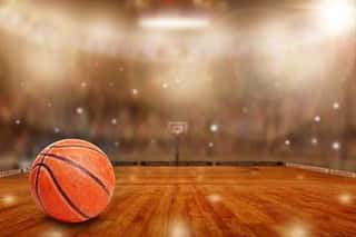 Fictitious Basketball Arena With Ball On Court And Copy Space  Camera Flashes And Lens Flare Special Lighting Effect On Defocused Background  Wall Mural