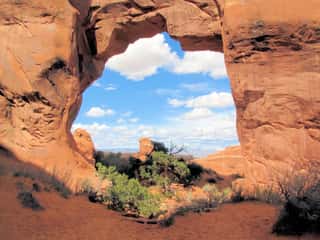 Blue & White Sky Viewed Through Sandstone Arch Wall Mural