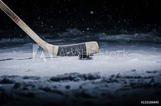 Hockey Stick And Puck On The Ice Rink Wall Mural