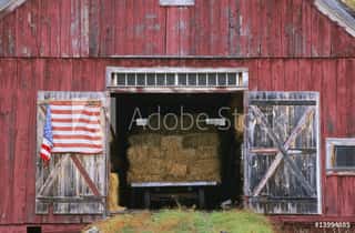 American Flag Hanging From A Barn Door Wall Mural