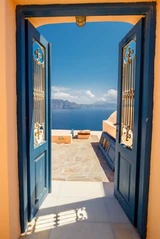 Opened Door Into Summer Concept  Oia Village On  Santorini Island, Famous And Popular Greek Resort In Aegean Sea  Europe  Wall Mural