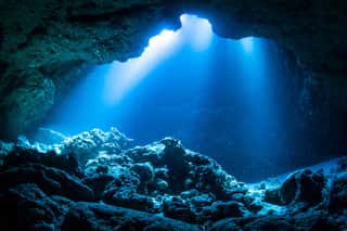 Sun Light Into The Underwater Cave Wall Mural