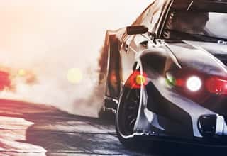 Blurred Sport Car Drifting On Speed Track  Sport Car Wheel Drifting And Smoking With Flare Effect On Track  Sport Concept,drifting Car Concept  Wall Mural