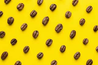Coffee Beans Pattern On Yellow Background Wall Mural
