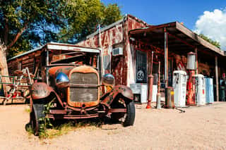 Abandoned Retro Car In Route 66 Gas Station, Arizona, Usa Wall Mural