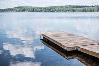 Landscape Of Wooden Dock Floating In Lake At Sweden Countryside Wall Mural
