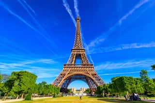 Paris Eiffel Tower And Champ De Mars In Paris, France  Eiffel Tower Is One Of The Most Iconic Landmarks In Paris  The Champ De Mars Is A Large Public Park In Paris Wall Mural