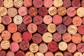 Wine Corks Background, Overhead Photo Of Red And White Wine Corks Wall Mural