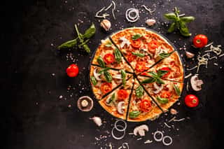 Tasty Pizza With Cherries, Onions And Mushrooms On A Black Background Wall Mural