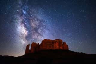 A Meteor Streaks Through The Milky Way Above Cathedral Rock In Sedona, Arizona  Wall Mural