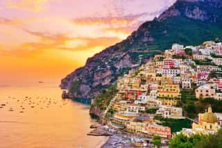View Of Positano Village Along Amalfi Coast In Italy At Sunset  Wall Mural