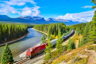 Train Passing Famous Morant\'s Curve At Bow Valley In Autumn ,Banff National Park, Canadian Rockies,Canada  Wall Mural