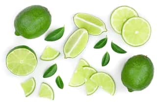 Sliced Lime With Leaves Isolated On White Background  Top View  Flat Lay Pattern Wall Mural