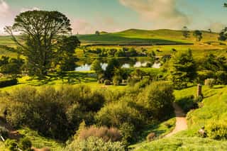 Panorama With Green Dragon Sunset In Hobbiton, New Zealand Wall Mural