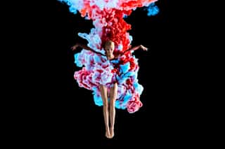 Modern Art Collage  Concept Ballerina With Colorful Smoke  Abstract Formed By Color Dissolving In Water On Black Background Wall Mural