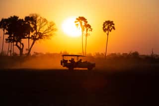 Silhouette Of A Safari Jeep At Sunset Wall Mural