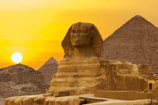 Sphinx Against The Backdrop Of The Great Egyptian Pyramids  Africa, Giza Plateau 	 Wall Mural