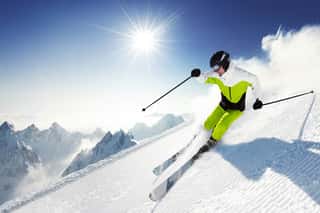 Skier In Mountains, Prepared Piste And Sunny Day Wall Mural