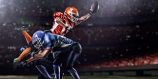 American Football Player In Action At Game Time Wall Mural