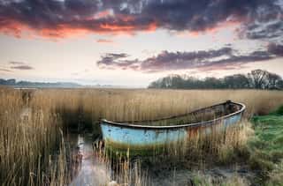 *CLEARANCE* Beautiful Sunset Over An Old Rusty Fishing Boat Wall Mural