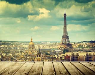 Background With Wooden Deck Table And Eiffel Tower In Paris Wall Mural
