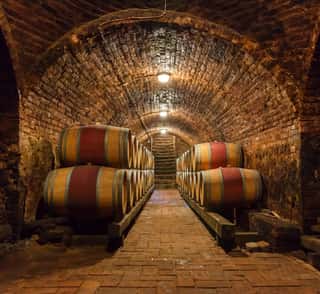 Oak Barrels In A Underground Wine Cellar    Wall Mural