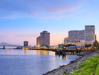 Downtown New Orleans, Louisiana And The Missisippi River Wall Mural