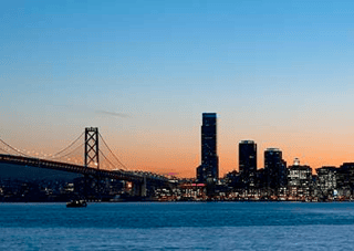 City Skyline And A Bridge At Dusk, Bay Bridge, San Francisco, California, USA Wall Mural