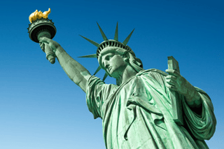 Statue Of Liberty In New York, USA  Blue Sky Panoramic Background With Copy Space Wall Mural