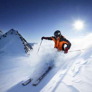 Skier in High Mountains Wall Mural