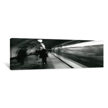 Image of Subway Train Passing Through A Subway Station, London, England Canvas Print