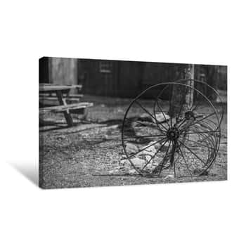 Image of BW Metal Wheels Near Barn Canvas Print