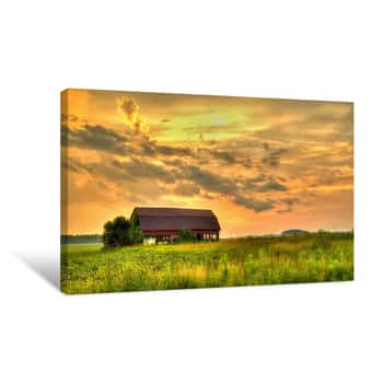 Image of Wooden Barn Sunset  Rural Sunset With An Abandoned Barn Surrounded By Farm Fields  Canvas Print