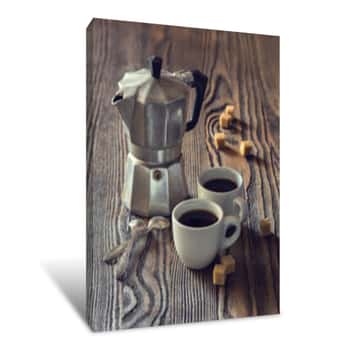 Image of Two Cups Of Coffee With Pieces Of Cane Sugar And Italian  Coffee Maker On Wooden Table   Toned Image  Canvas Print