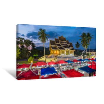 Image of Temple In Luang Prabang Royal Palace Museum And Famous Night Market At Twilight Time,Luang Prabang, Laos  Colorful Night Market UNESCO World Heritage Site In 1995  Canvas Print