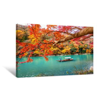 Image of Boatman Punting The Boat At River  Arashiyama In Autumn Season Along The River In Kyoto, Japan  Canvas Print