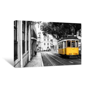 Image of Yellow Tram On Old Streets Of Lisbon, Portugal, Popular Touristic Attraction And Destination  Black And White Picture With A Coloured Tram  Canvas Print