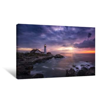 Image of Sunshine Breaking Through Dark Clouds At Portland Head Lighthouse In Maine Canvas Print