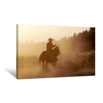 Image of Silhouette Of Cowboy Riding Horse At Sunset Canvas Print