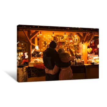 Image of Love, Winter Holidays And People Concept - Happy Senior Couple Hugging At Christmas Market Souvenir Shop Stall In Evening Canvas Print
