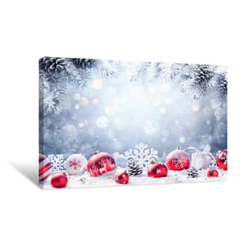 Image of Christmas - Red Ornament On Snow With Fir Branches Canvas Print