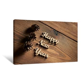Image of Happy New Year! - A Phrase With Wooden Letters On A Wooden Backg Canvas Print