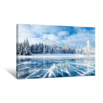 Image of Blue Ice And Cracks On The Surface Of The Ice  Frozen Lake Under A Blue Sky In The Winter  The Hills Of Pines  Winter  Carpathian, Ukraine, Europe Canvas Print