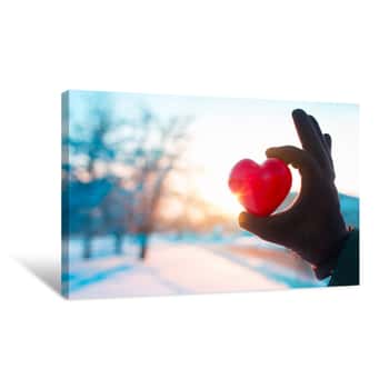 Image of Hand With Heart On Winter Background Canvas Print