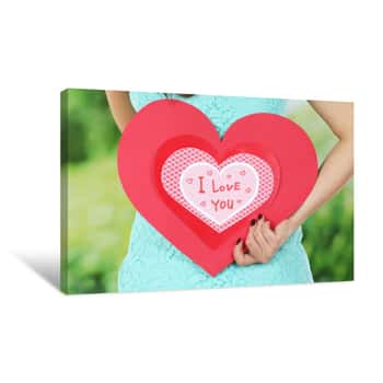 Image of Girl Holding Valentine Card On Bright Background Canvas Print
