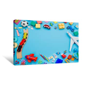 Image of Frame Of Kids Toys On Blue Background Canvas Print