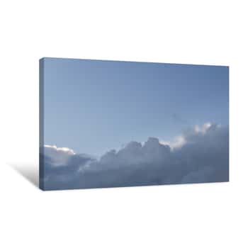Image of The Clear Blue Sky With Puffy Clouds At The Bottom  A Natural Background For Images, Copy Space Canvas Print