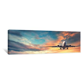Image of Landing Airplane  Landscape With White Passenger Airplane Is Flying In The Blue Sky With Multicolored Clouds At Sunset  Travel Background  Passenger Airliner  Business Trip  Commercial Aircraft Canvas Print