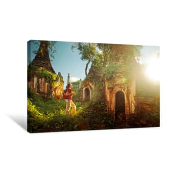 Image of Backpacker Traveling And Looks At Sunset Among Stupas  Myanmar Canvas Print